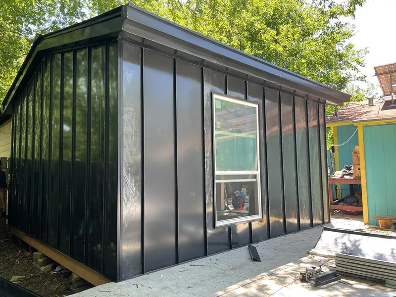 Black standing seam metal wall panels for Roof Inspection in Webster